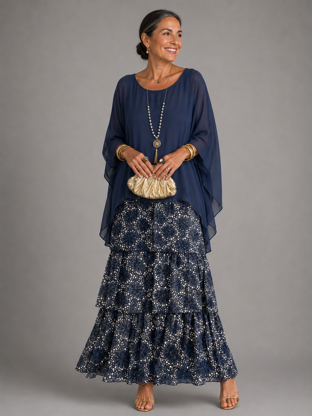 Dark blue tiered maxi dress with sheer sleeves and layered floral skirt