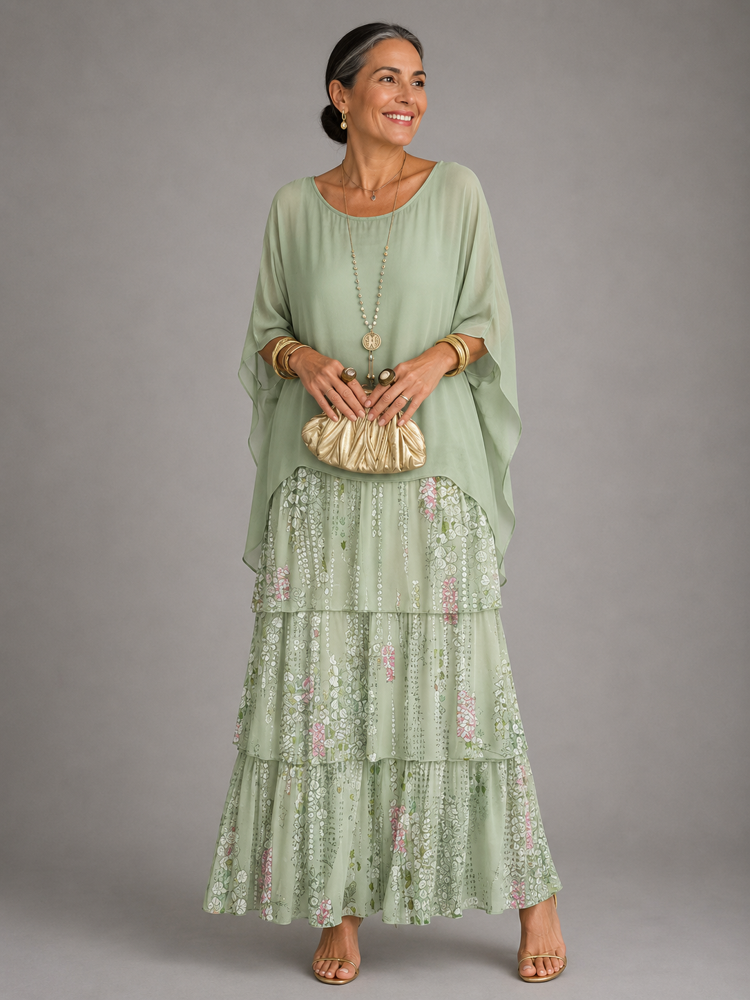 Light green tiered maxi dress with sheer long sleeves and floral ruffle hem