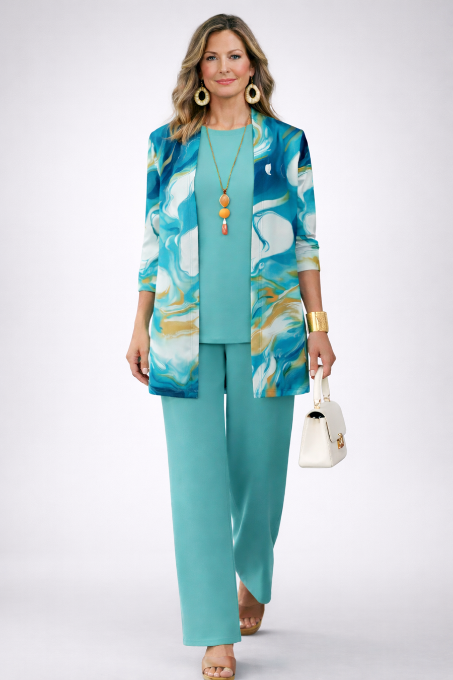 Three-piece trouser set: turquoise pants with matching top and patterned jacket