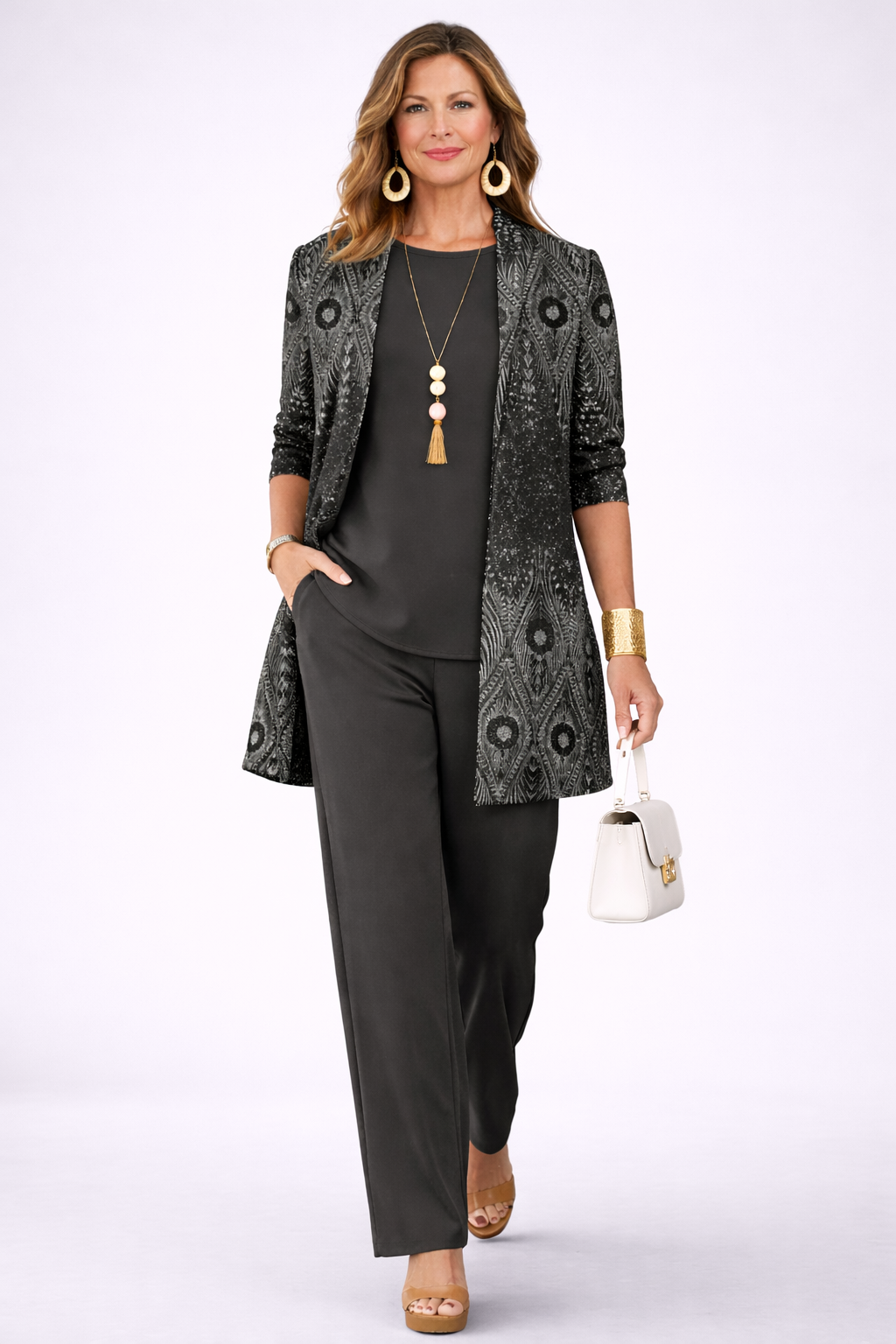 Black three-piece trouser set with patterned blazer, camisole, and straight trousers, necklace