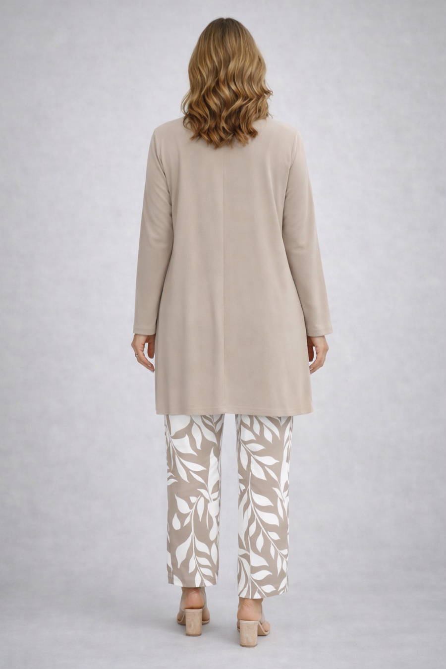 Beige three-piece trouser set, long back tunic over white leaf-print trousers