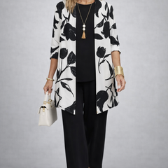 Three-piece trouser set: white floral open-front jacket, black trousers, black top