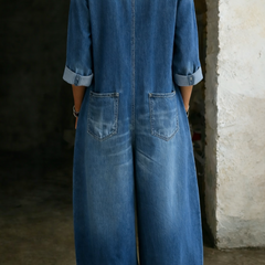 Blue denim overall back view with waist seam and patch pockets at sides