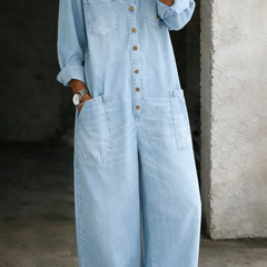 Light blue denim overall with button-front, chest pockets, and long sleeves
