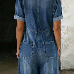 Back-view blue denim short-sleeve overall with yoke seam and two back pockets