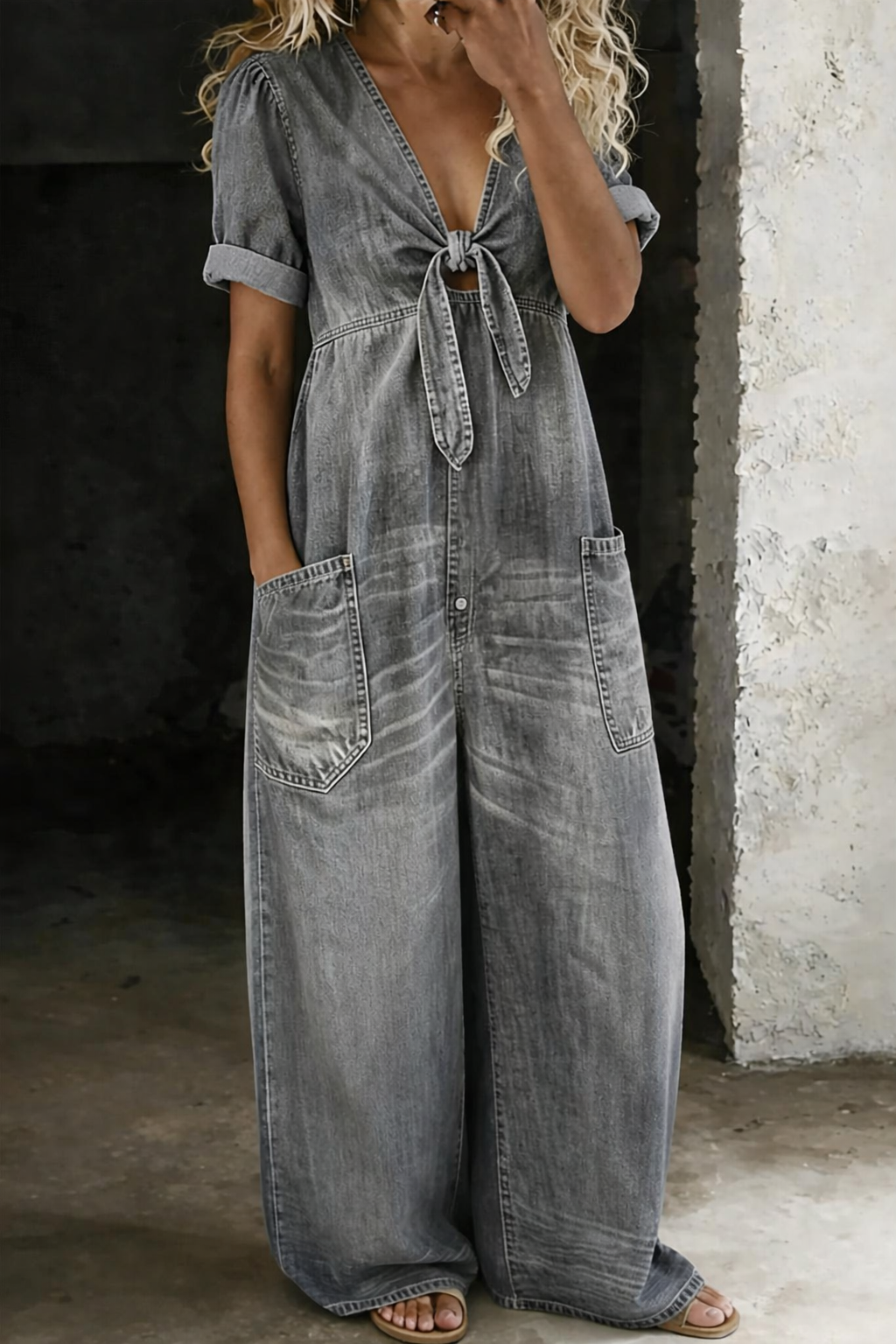 Grey washed denim V-neck short-sleeve overall with tie front and two front pockets
