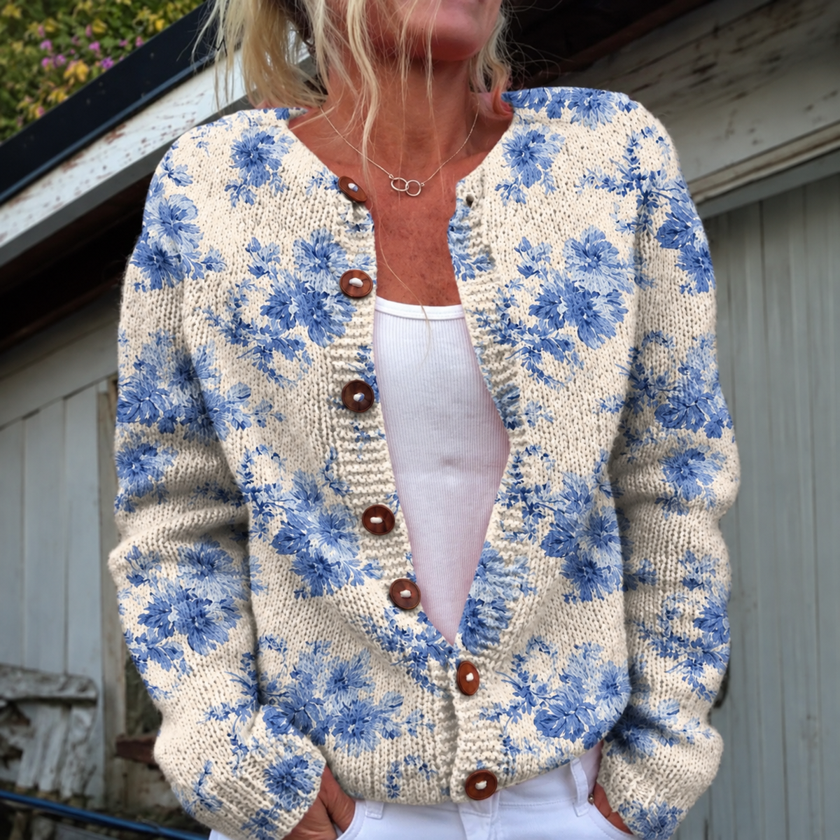 Vintage knit cardigan sweater in blue floral print with brown button placket
