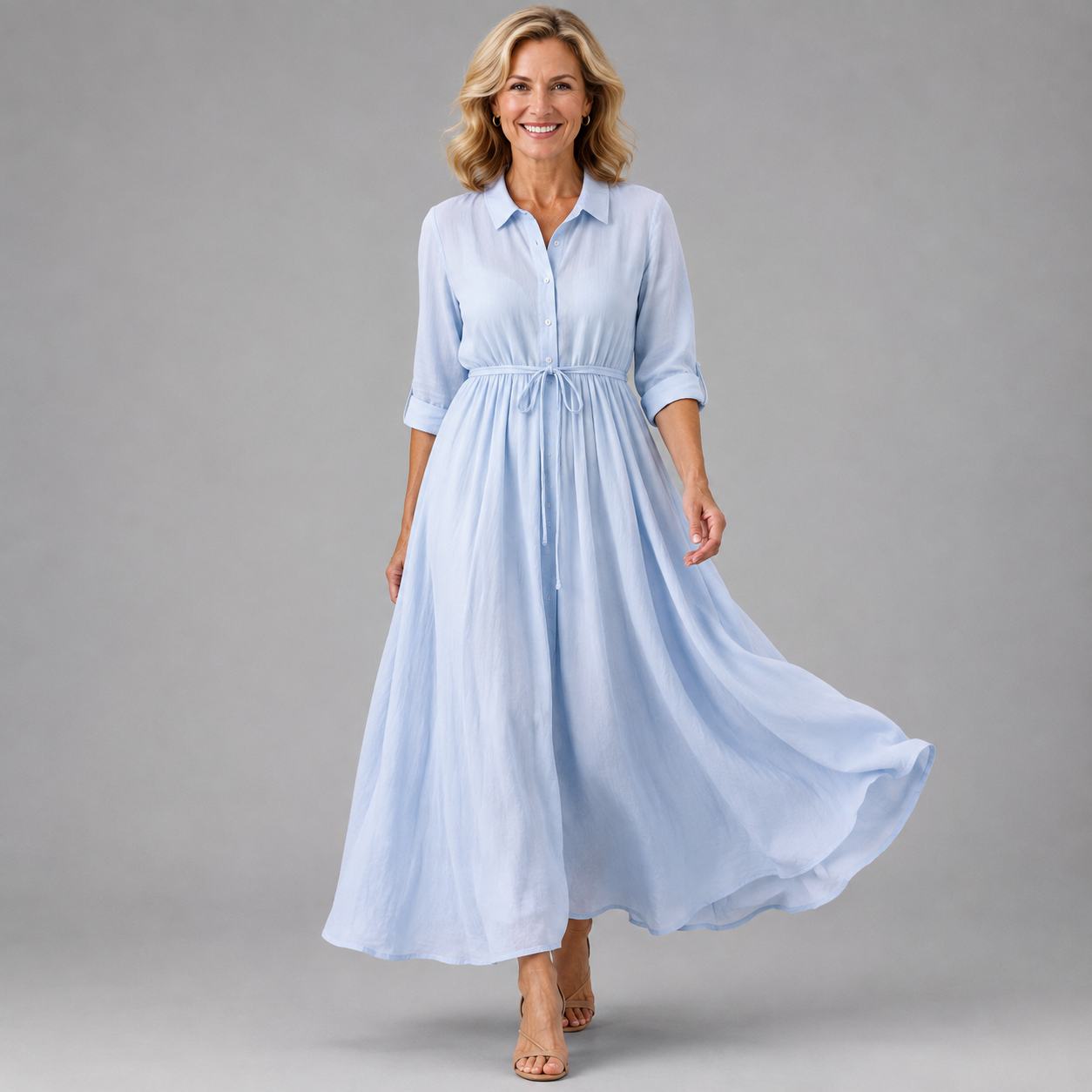 Light blue button-front midi dress with collar, 3/4 sleeves, and tied waist