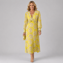 Yellow midi wrap dress with V-neck and purple daisy-like floral pattern, long sleeves