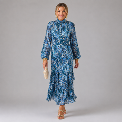 Blue abstract patterned maxi dress with high neck, long sleeves, and tiered skirt