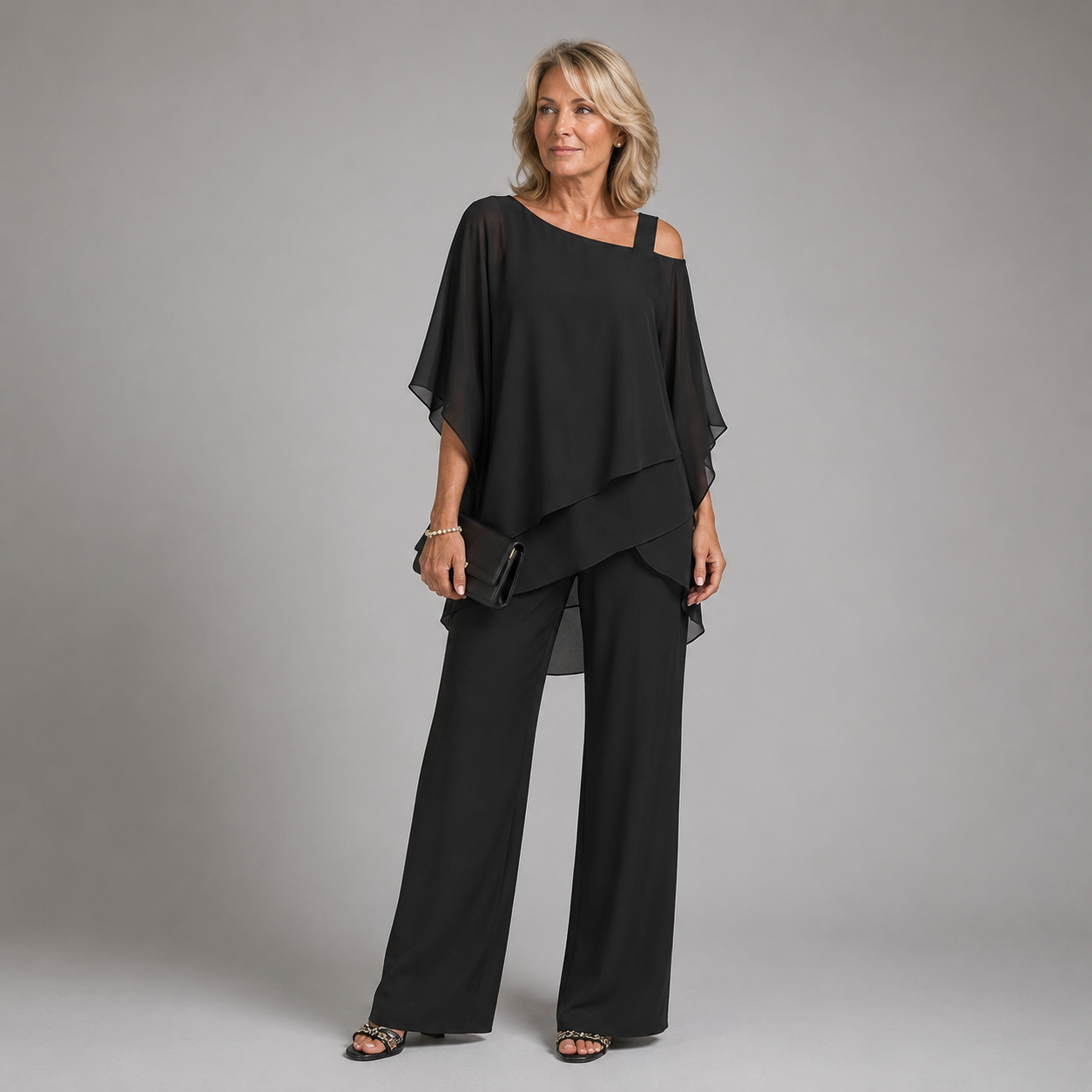 Black layered two-piece pants set with draped square-neck blouse and wide-leg trousers