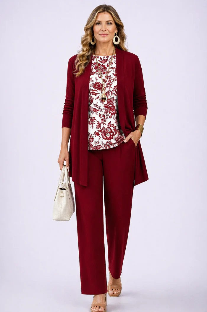 Burgundy three-piece trouser set with patterned blouse, long cardigan, and tapered trousers