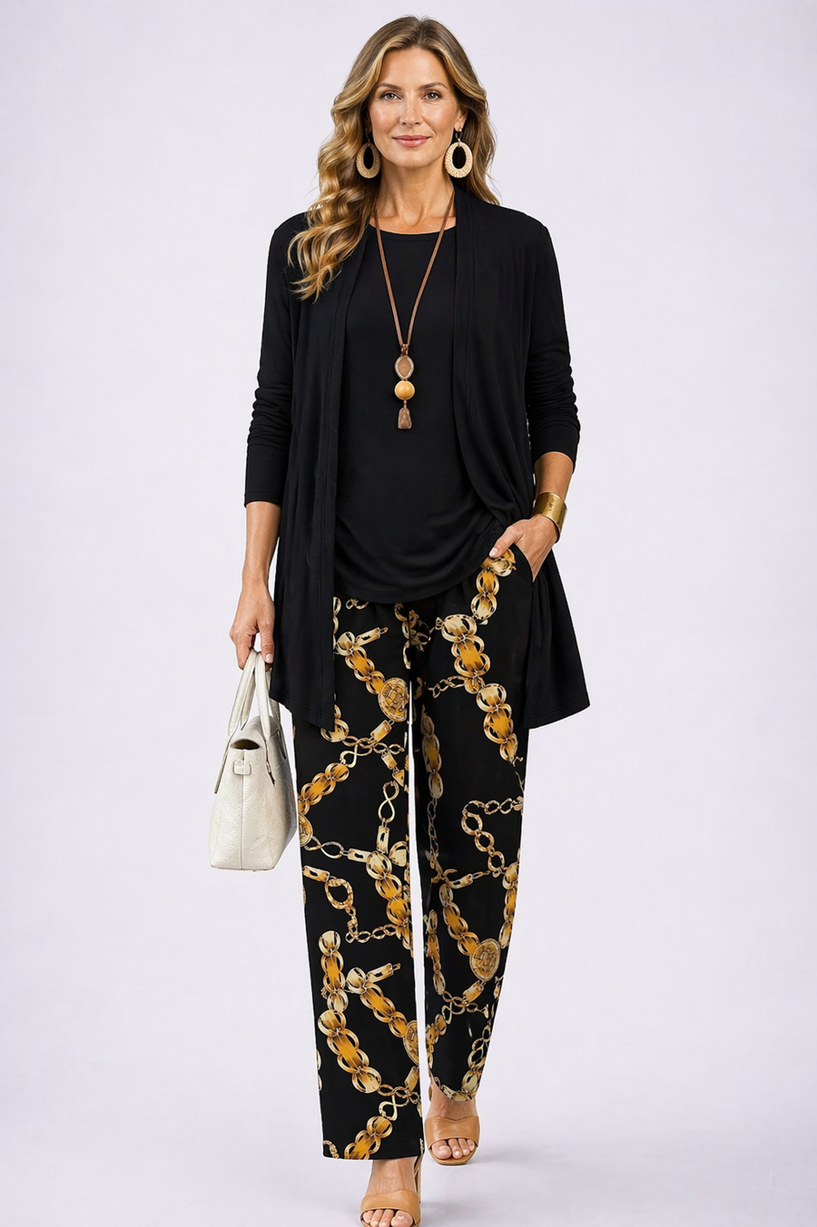 Women's black three-piece trouser set with gold chain print trousers and long cardigan
