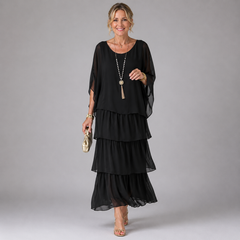 Black tiered maxi dress with sheer flowy sleeves and layered ruffle skirt
