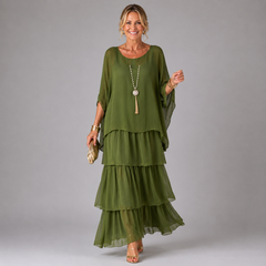 Dark green tiered maxi dress with flowing layered skirt and loose dolman sleeves