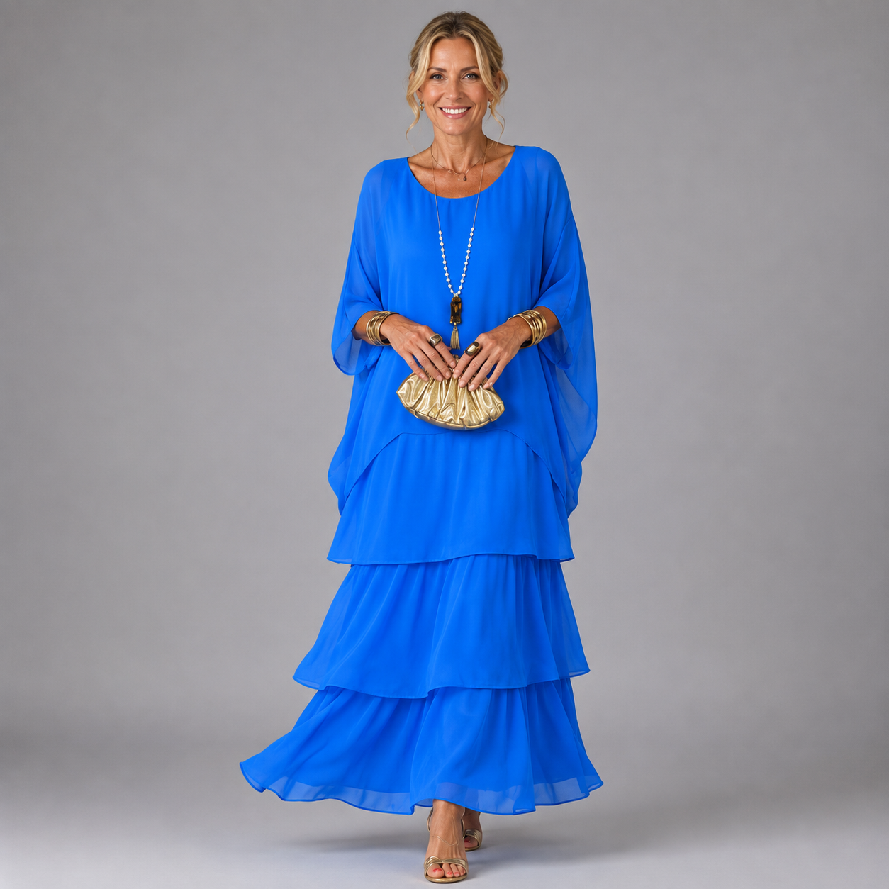 Blue tiered maxi dress with flowy layered skirt and elbow-length sleeves