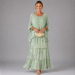 Light mint tiered maxi dress with floral print lower skirt and flowy ruffles