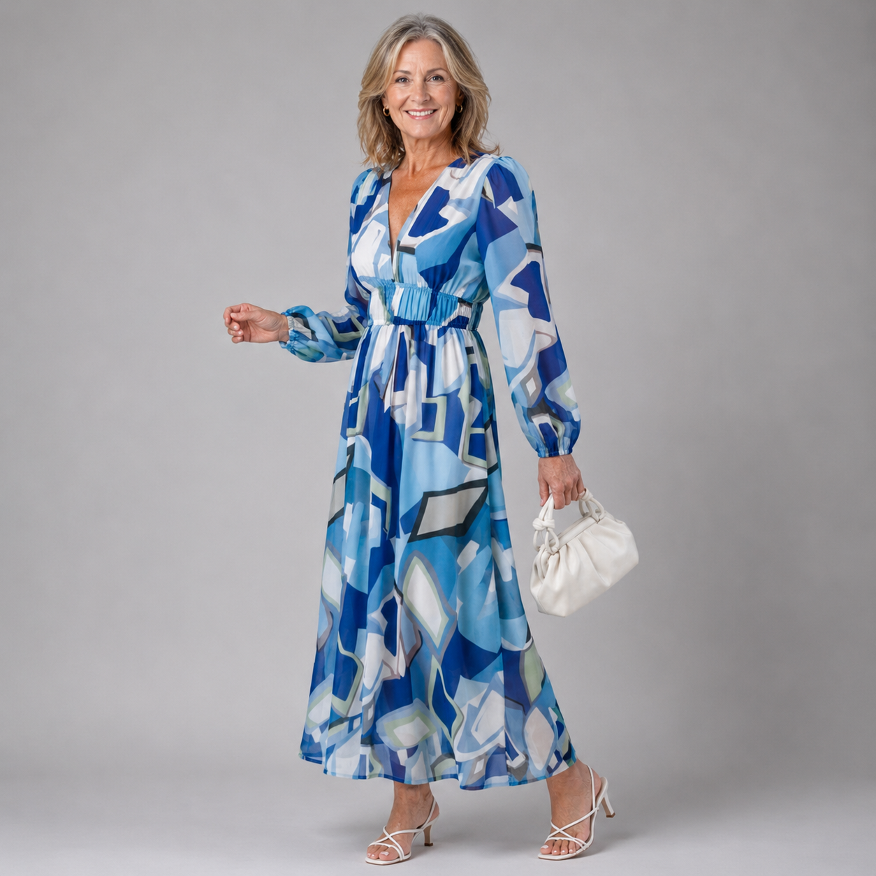 Blue and white geometric print long-sleeve maxi dress with V-neck and gathered waist