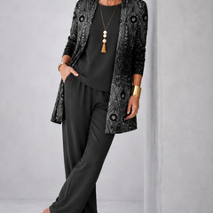 Black three-piece trouser set with patterned blazer, camisole, and wide-leg trousers