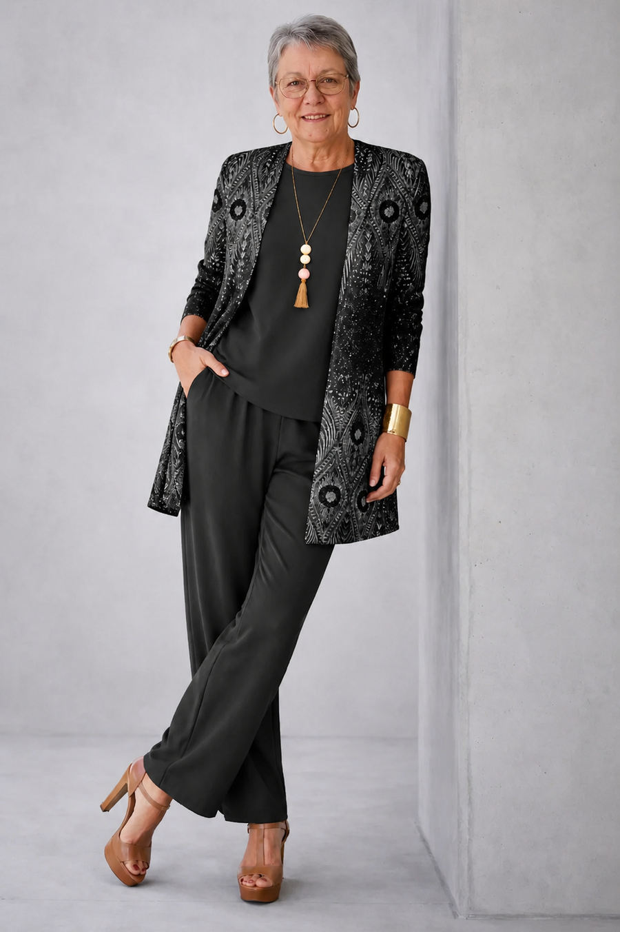 Black three-piece trouser set with patterned blazer, camisole, and wide-leg trousers