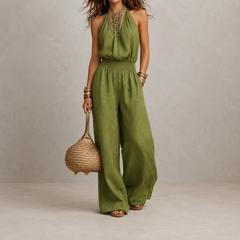 Tuta elegante verde senza maniche, vita arricciata e pantaloni ampi
