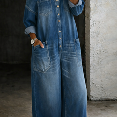Blue off-shoulder denim overall with chest pockets, long button front, and wide shoulder straps