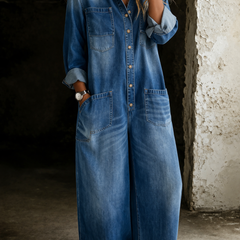 Blue denim overall with button-front, chest pockets, and long sleeves