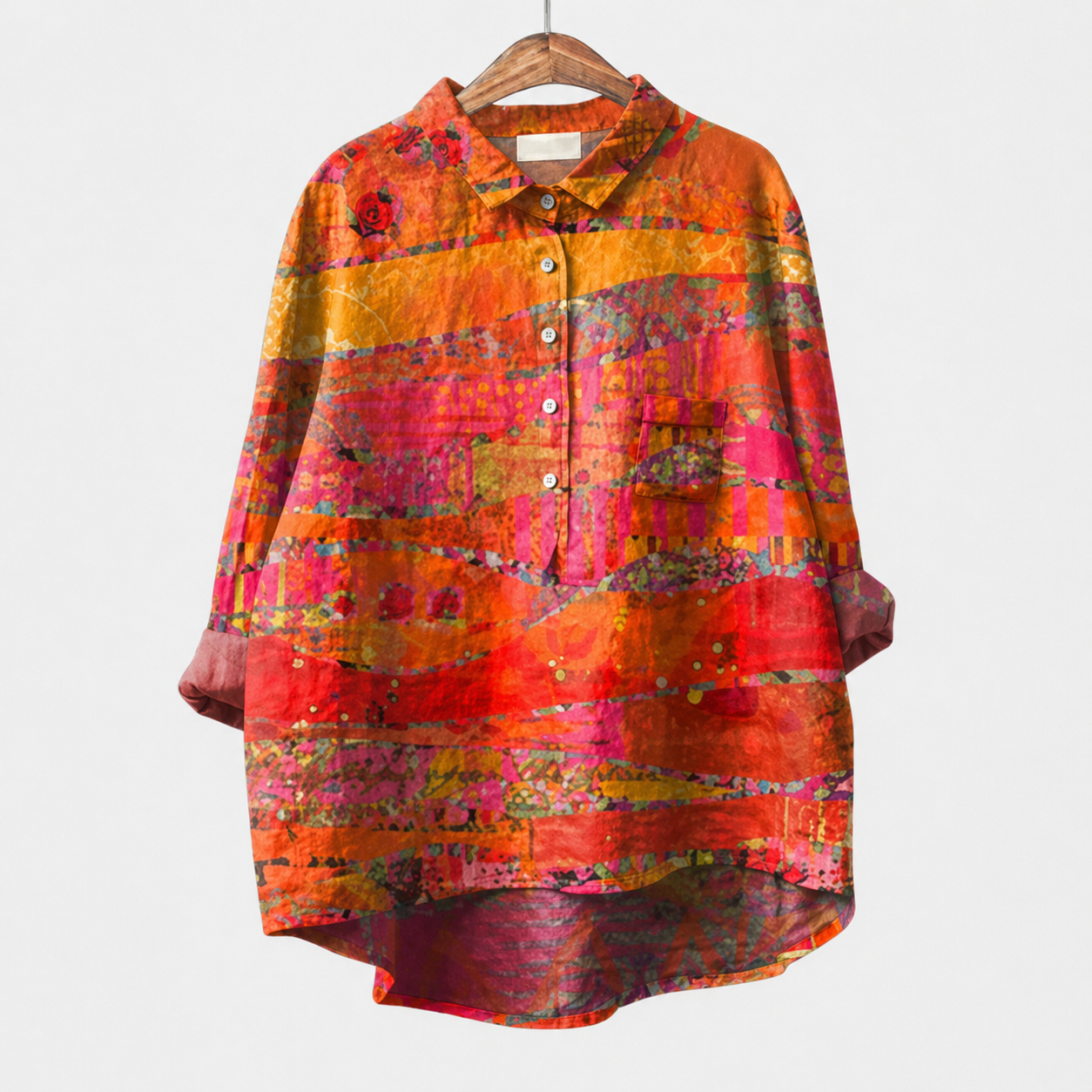 Blusa estiva arancione a maniche lunghe, bottoni frontali e fantasia multicolore