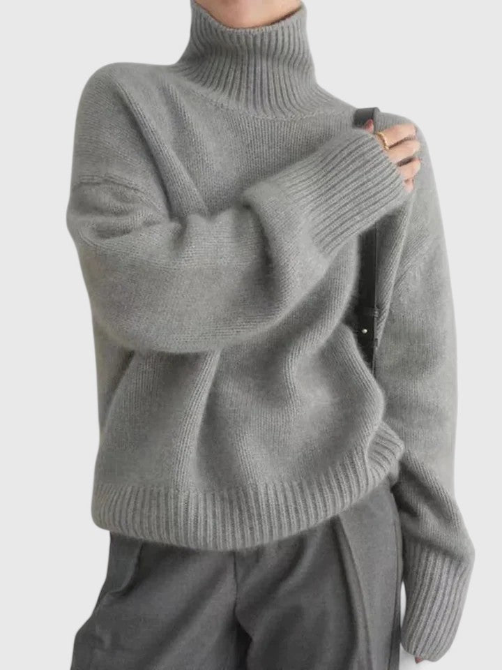Grey turtleneck knit jumper with long sleeves and ribbed cuffs and hem