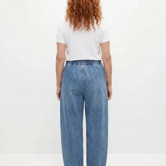Blue relaxed elastic-waist denim trousers, back view with wide straight legs
