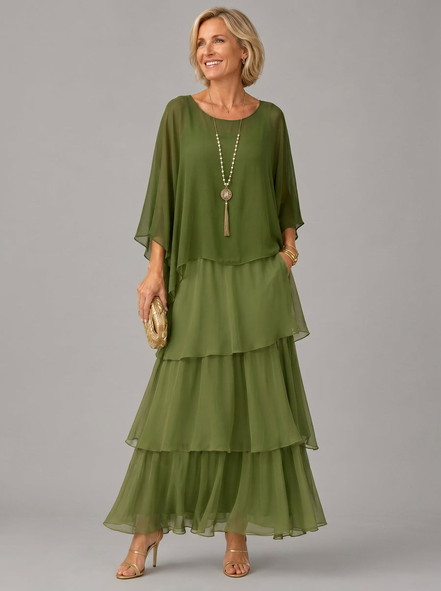 Green tiered maxi dress with dolman sleeves and scoop neckline, airy layered ruffle skirt