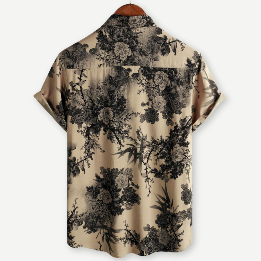 Men's short-sleeve button-up shirt with black floral pattern on tan background