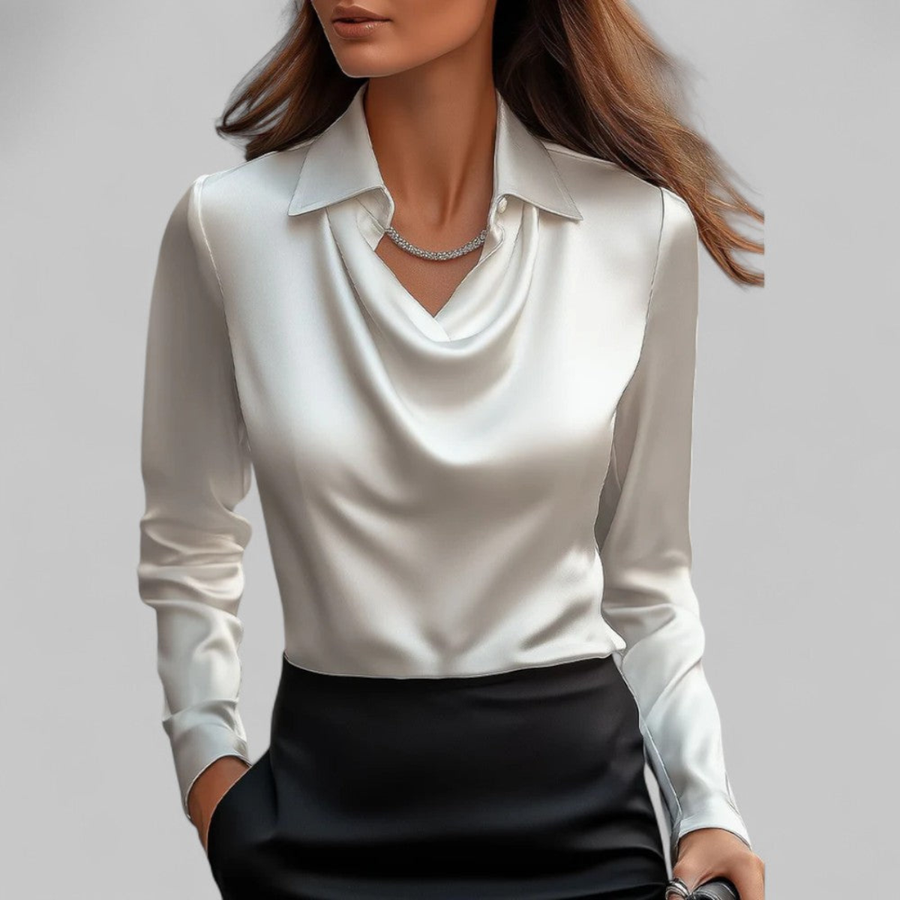 White satin draped blouse with long sleeves, cowl neckline, and pointed collar