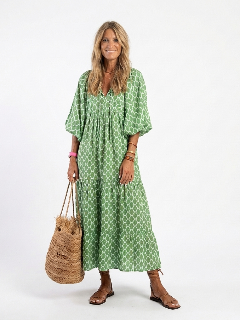 Green patterned V-neck midi dress with short puff sleeves and gathered waist