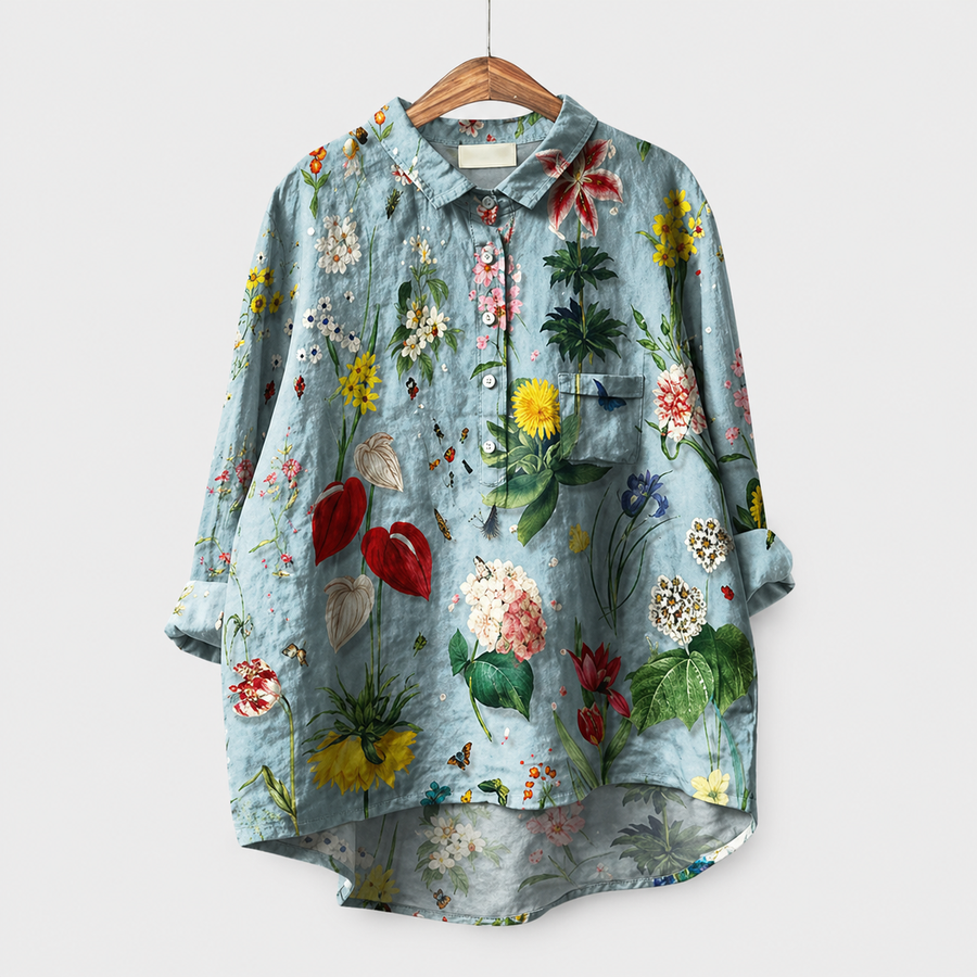 Blusa estiva azzurra a maniche lunghe con stampa floreale tropicale e bottoni