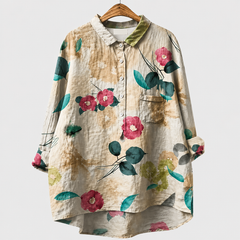 Blusa estiva a bottoni stampa floreale verde e rosa su fondo chiaro, taschino