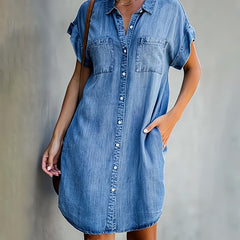 Blue button-through denim shirt dress with short sleeves, collar, and chest pockets