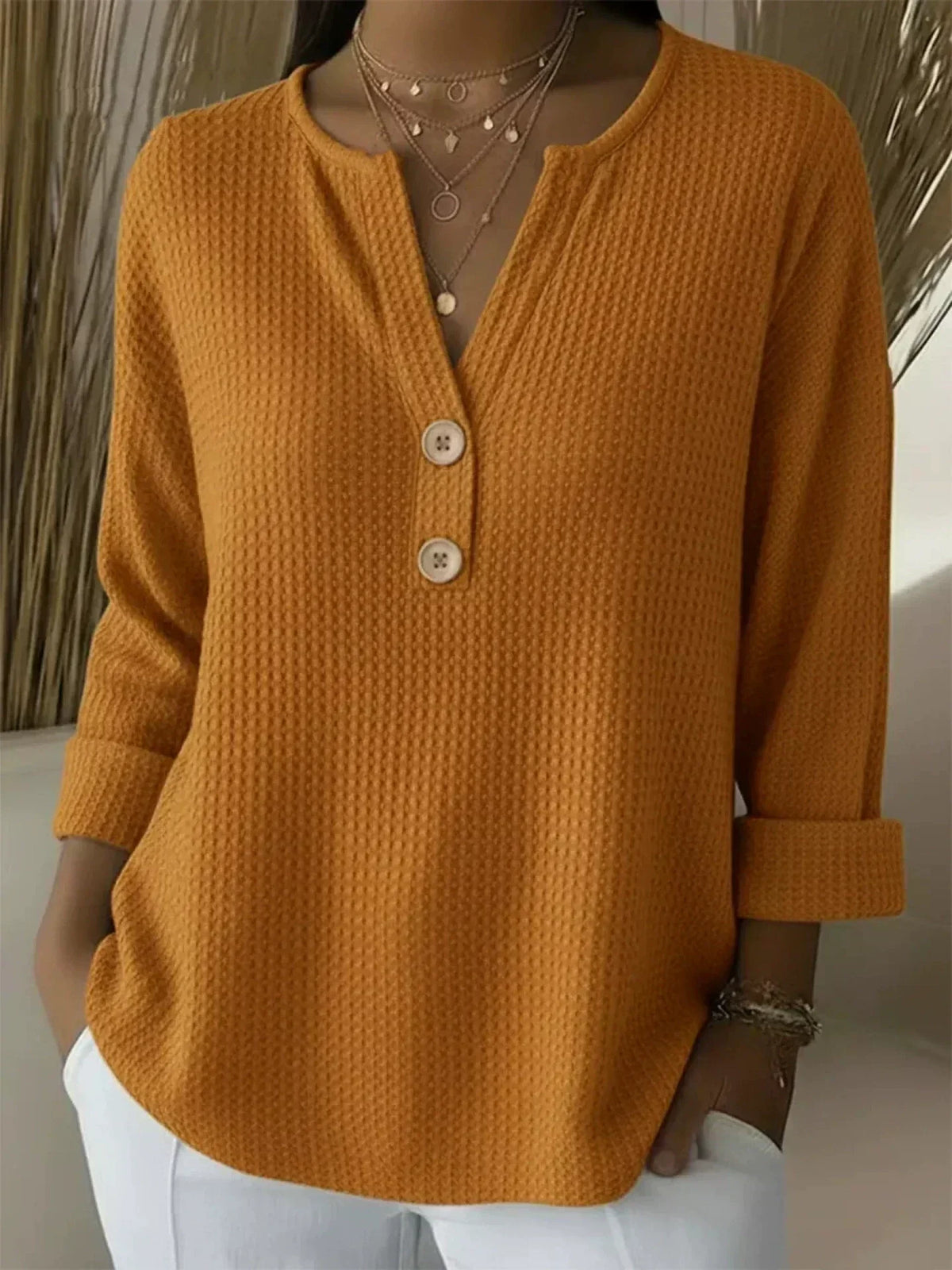 Mustard henley button top, waffle-knit long sleeve with V-neck and three buttons
