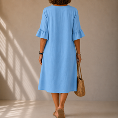Light blue back view of button-front midi dress with ruffle sleeves and A-line skirt