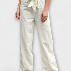Wide-leg trousers with tie belt, white linen-blend look, relaxed drape and cuffed hems