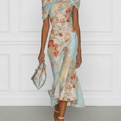 Off-shoulder midi mermaid dress in blue floral print, sleeveless with draped neckline