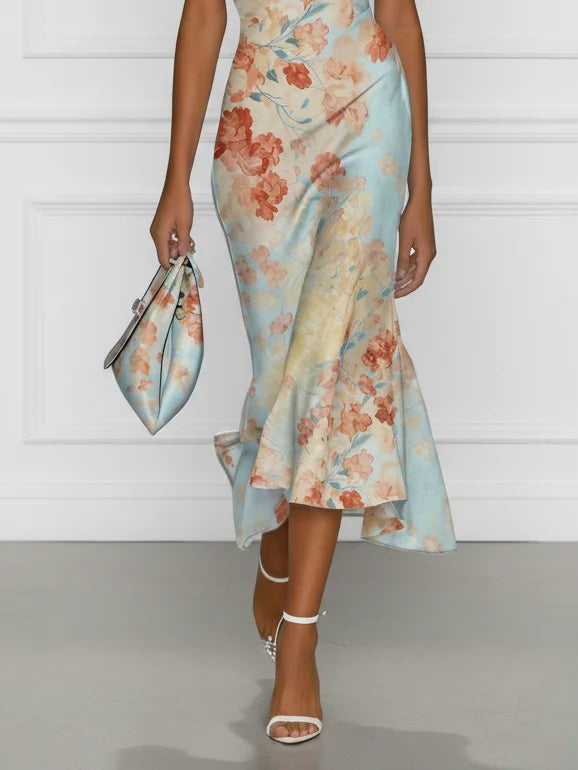 Off-shoulder midi mermaid dress in blue floral print, sleeveless with flared midi hem