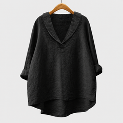 Blusa estiva nera in tessuto leggero, scollo a V, maniche ampie e vestibilità ampia.