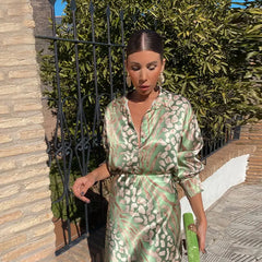 Green and beige patterned V-neck midi dress with gathered tie waist