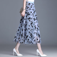 Light blue midi tulle skirt with dark navy floral print and elastic waistband