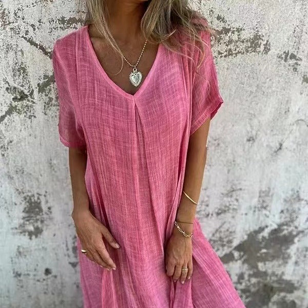 Abito rosa a V con maniche corte e tessuto leggero