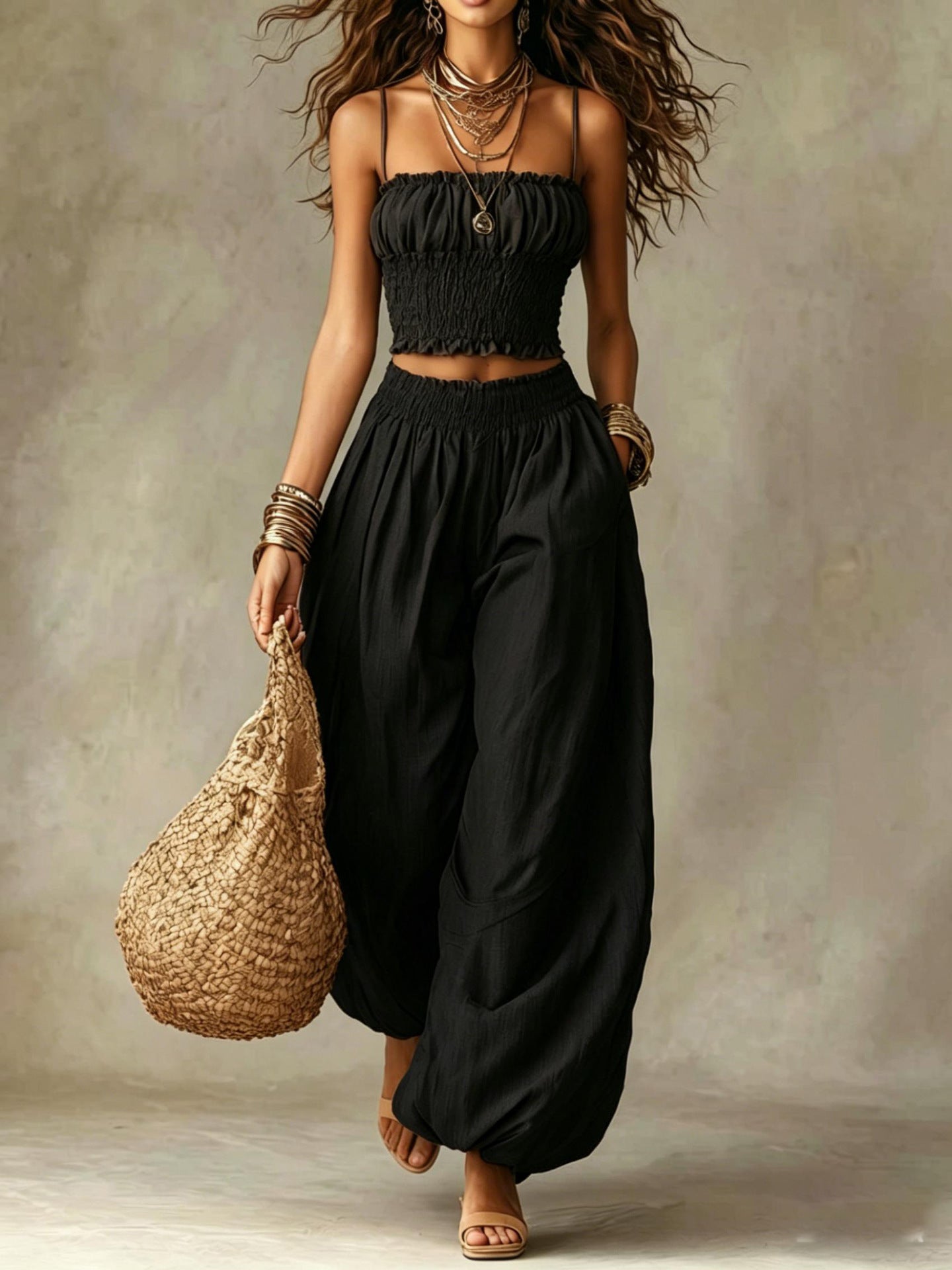 Smocked crop top and wide-leg pants set in black, ruched crop top and relaxed wide-leg fit.