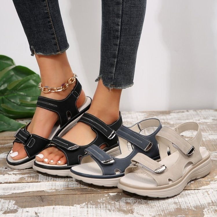 Supportive orthopaedic sandals in black and beige with hook-and-loop closures
