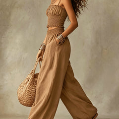 Smocked crop top and wide-leg pants set in khaki, sleeveless gathered bodice and flowy legs.
