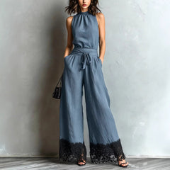 Sky blue halter-neck lace-trim wide-leg jumpsuit with waist belt tie and black lace cuffs